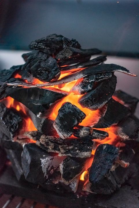 black and orange fire on black charcoal